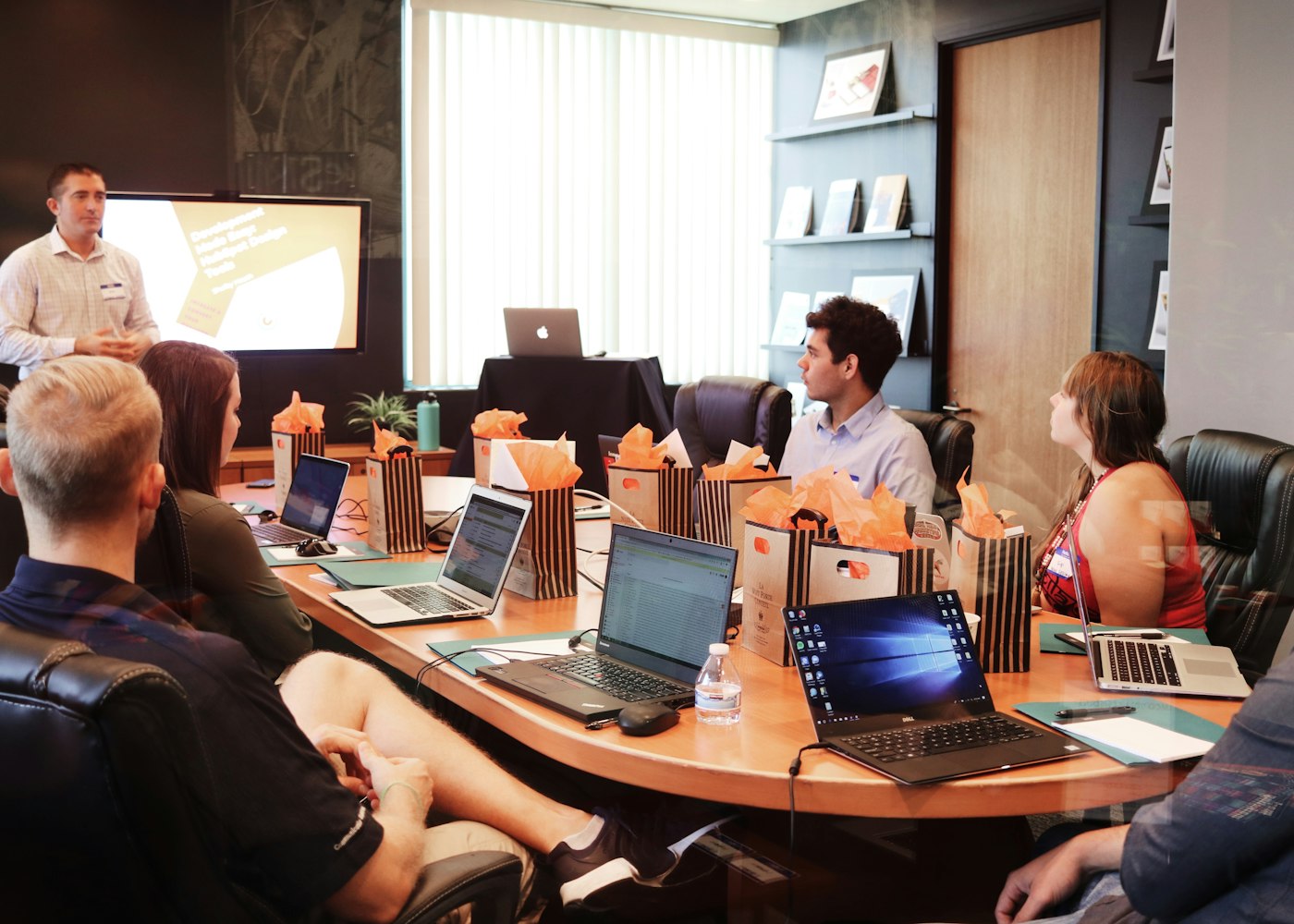 Business consultants reviewing a client growth plan around a table
