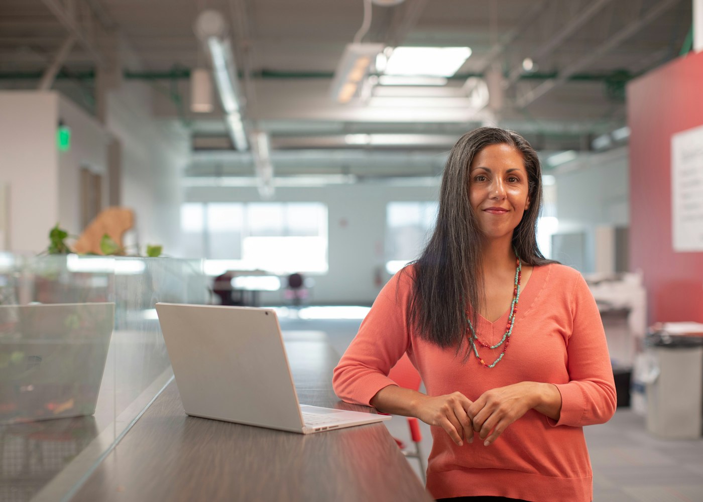 Small business owner working on her laptop, growing her customer base online